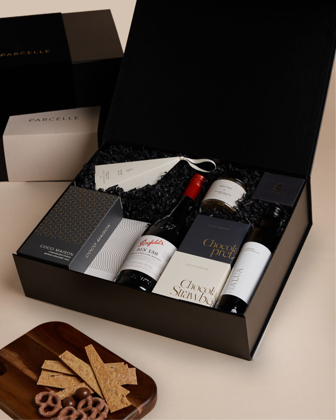 Parcelle | Corporate Penfolds Christmas Hamper with Bin 138 Shiraz GSM, olive oil, savoury crackers, tapenade, chocolates and cashews in Parcelle XL Gift Box with custom branding and ribbon