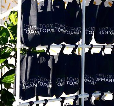 Parcelle | Custom made and designed Denim Tote Bags Hanging at an activiation to be handed out to passers by at an event