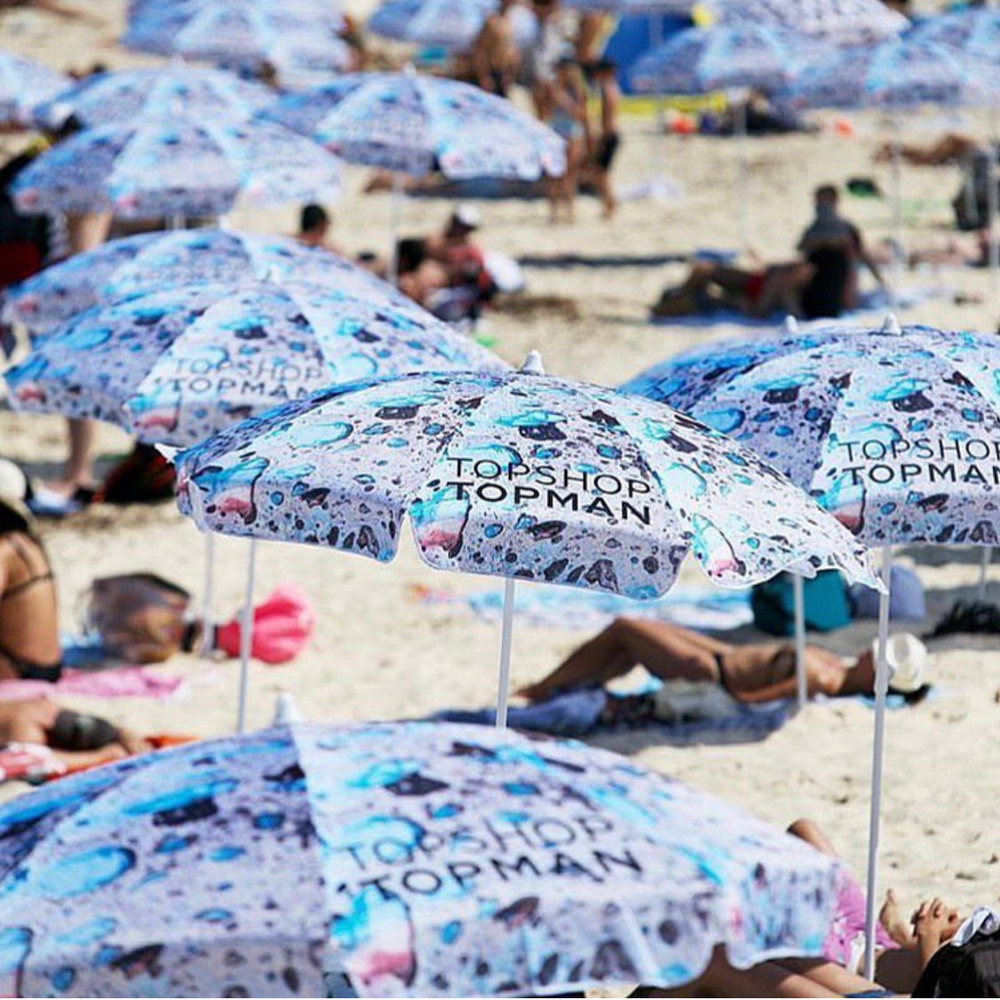 Parcelle | Custom Printed Beach Umbrellas | Product launch Activation Products | Premium Merchandise for your Brand