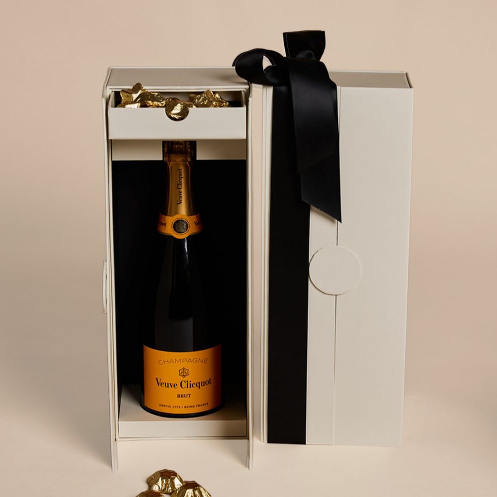 Parcelle | Luxury Veuve Christmas Cellar Gift Box with Veuve Clicquot Champagne and Belgian gold star chocolates in Parcelle’s signature double-door cellar box
