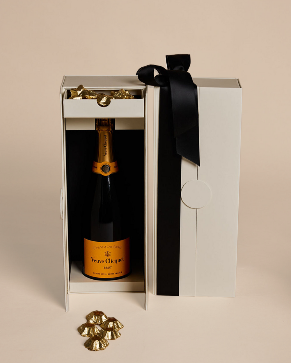 Parcelle | Luxury Veuve Christmas Cellar Gift Box with Veuve Clicquot Champagne and Belgian gold star chocolates in Parcelle’s signature double-door cellar box