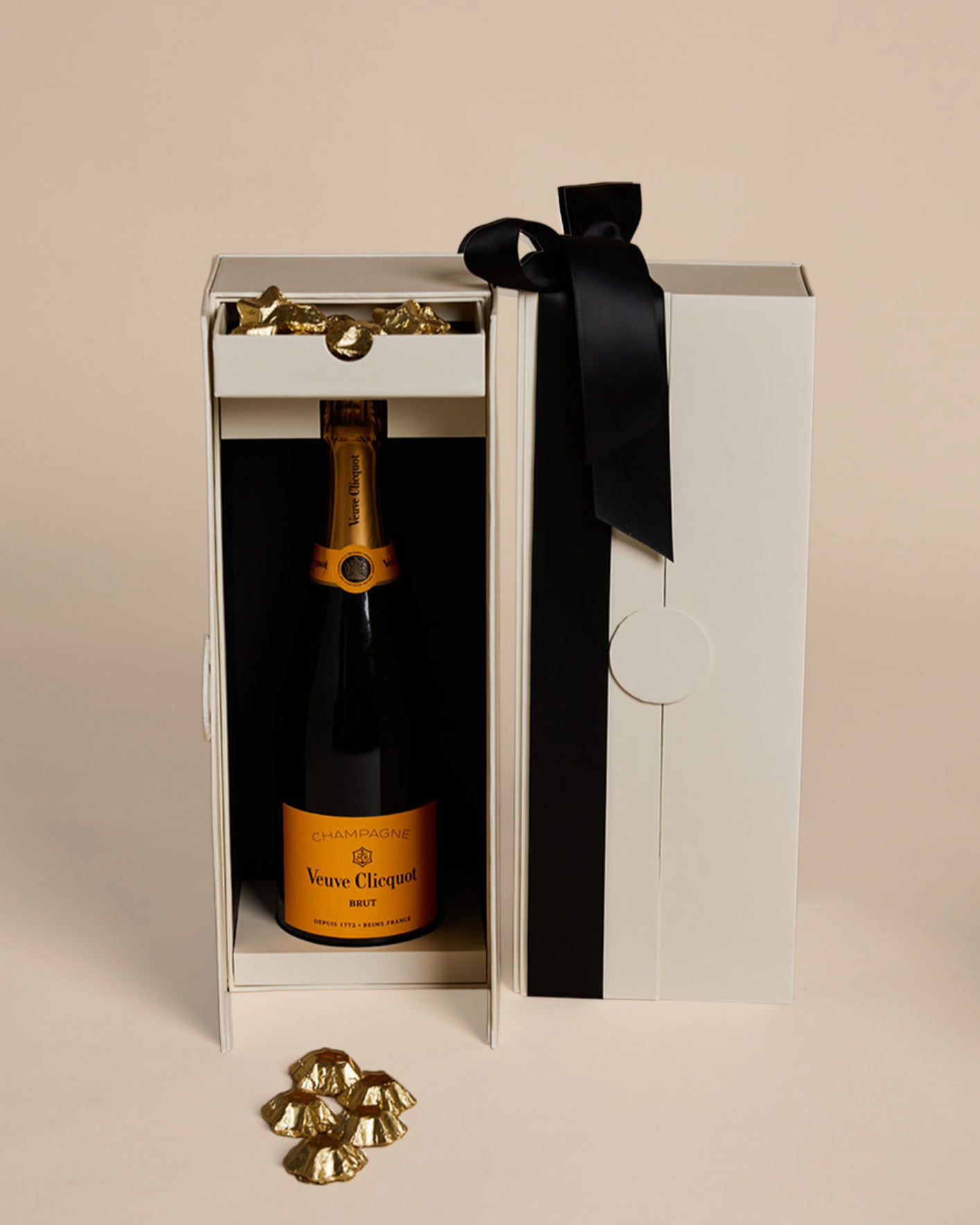 Parcelle | Luxury Veuve Christmas Cellar Gift Box with Veuve Clicquot Champagne and Belgian gold star chocolates in Parcelle’s signature double-door cellar box