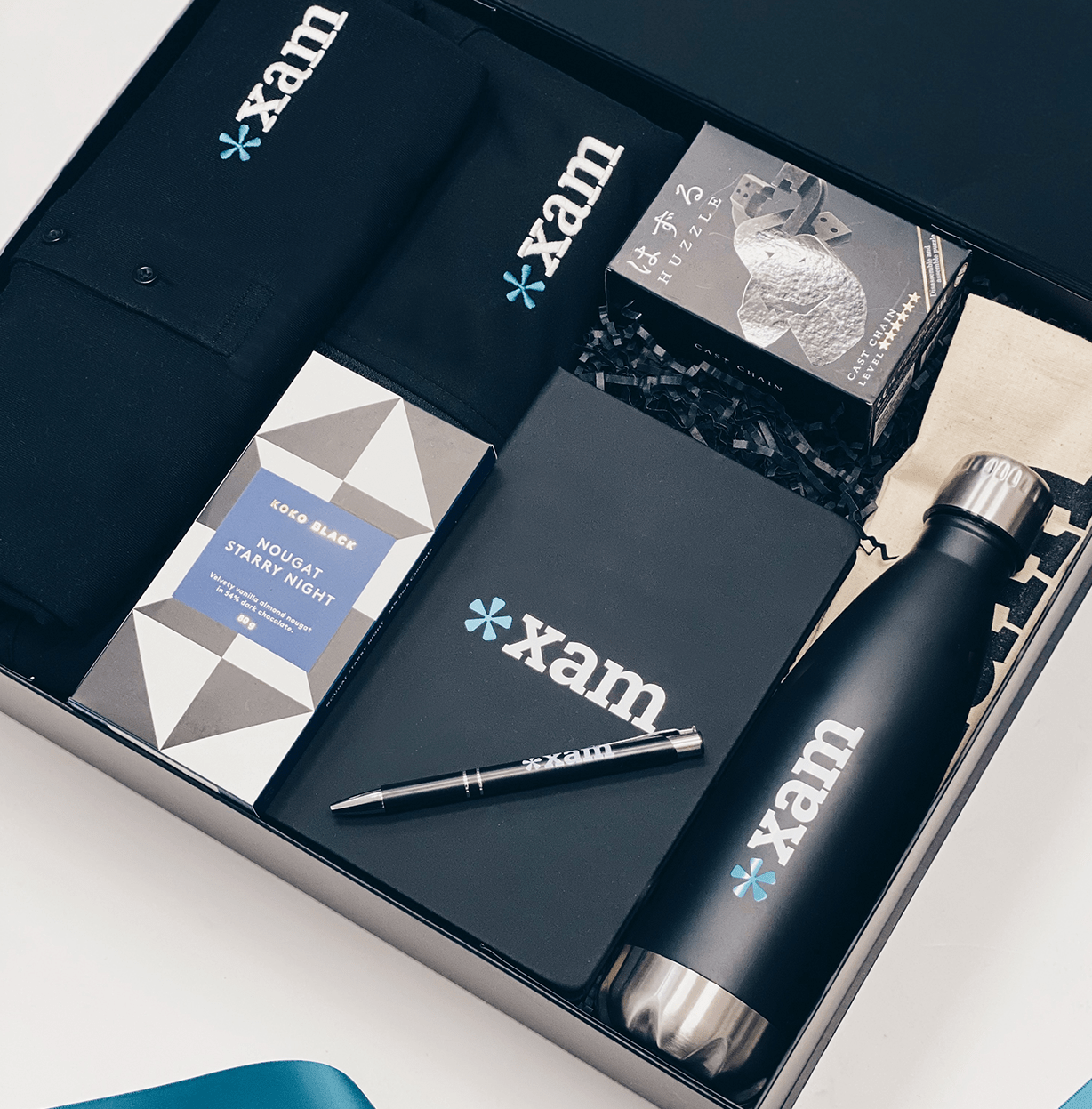 Parcelle | XAM Branded welcome onboard gift including Branded polo Shirt, Branded Jacket, Branded water bottle and notebook with Tote bag in gift box