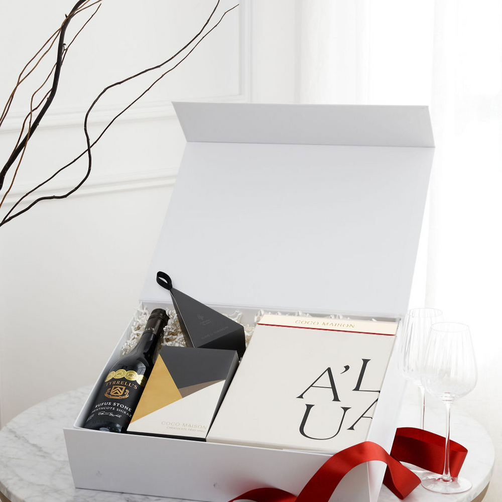 Parcelle | Shiraz Celebration luxury Christmas hamper with Rufus Stone Shiraz, Chocolate Trio, Biscoff Chocolate, Macadamias, and Premium Fluted Wine Glasses, presented in Parcelle XL Gift Box with Australiana or Candy Stripe sleeve, free branding available